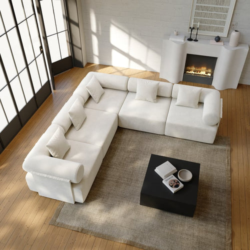 White L-shaped sectional sofa in a living room viewed from above.