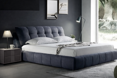 Dark upholstered Ashton bed with a padded headboard and pale bedding.