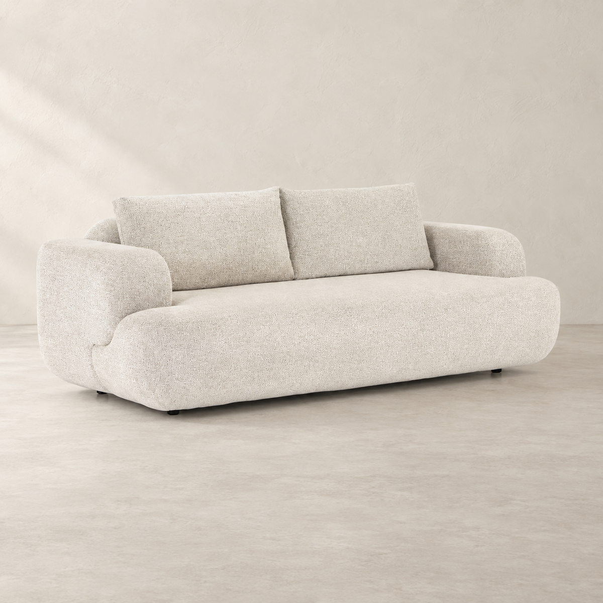 AI-assisted styled view of the Herman sofa, showing two broad back cushions, pale upholstery, rounded arms and low dark supports.