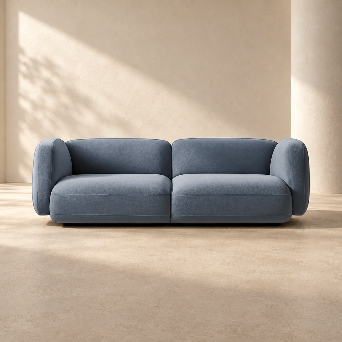 AI-assisted styled view of the blue-grey Marlin sofa with two seat sections and rounded arms.
