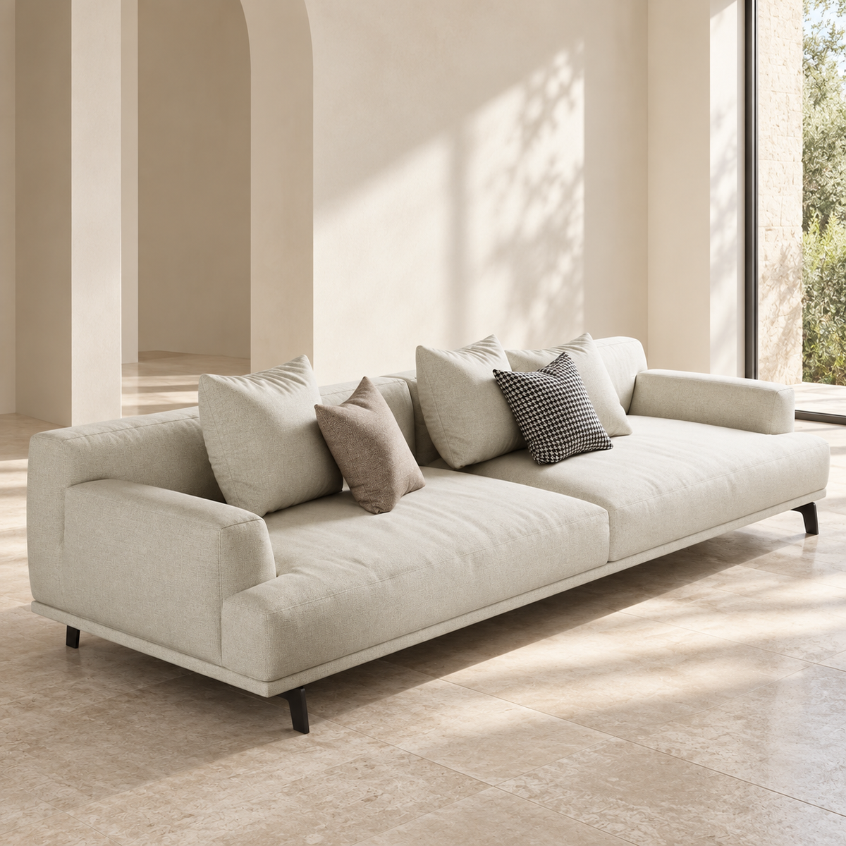 AI-assisted styled view of the cream Ovio sofa with two broad seats, low arms, dark angled feet and five loose cushions.